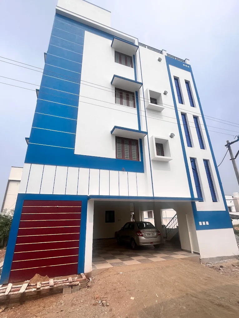 Three-storey blue and white residence with covered car parking